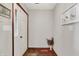 Inviting entryway with hardwood floors, a white door, and decorative accents at 12681 E 79Th St, Indianapolis, IN 46236