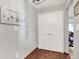 Entryway featuring wood floors, a double door closet, and artwork on the wall at 12681 E 79Th St, Indianapolis, IN 46236