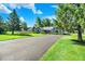 Landscaped front yard with a long driveway leading to a charming single-story home at 12681 E 79Th St, Indianapolis, IN 46236