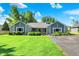 Charming single-story home boasts stone and gray siding, complemented by lush landscaping at 12681 E 79Th St, Indianapolis, IN 46236