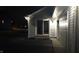 Exterior view of the home featuring a sliding glass door entry and attached garage at 12681 E 79Th St, Indianapolis, IN 46236
