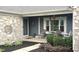 Charming front porch with decorative decor and porch swing with manicured landscaping at 12681 E 79Th St, Indianapolis, IN 46236