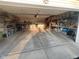 Spacious garage interior with a concrete floor and shelves, providing ample storage space at 12681 E 79Th St, Indianapolis, IN 46236