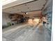 Spacious garage interior with a concrete floor and shelves, offering ample storage and organization options at 12681 E 79Th St, Indianapolis, IN 46236