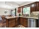 Well-appointed kitchen area with stainless appliances, granite counters and adjacent dining area at 12681 E 79Th St, Indianapolis, IN 46236