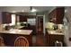 Modern kitchen with granite countertops, stainless steel appliances, and an island with seating at 12681 E 79Th St, Indianapolis, IN 46236