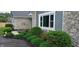 Attractive landscaping featuring stone accents, lush greenery, and well-maintained mulch beds at 12681 E 79Th St, Indianapolis, IN 46236