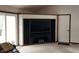 Living room with modern built-in entertainment center and sliding glass door at 12681 E 79Th St, Indianapolis, IN 46236