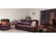 Spacious living room with plush leather seating and neutral carpeting at 12681 E 79Th St, Indianapolis, IN 46236