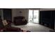 Spacious living room with carpet, comfortable seating, and sliding glass doors at 12681 E 79Th St, Indianapolis, IN 46236