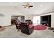 Open living room with fireplace, comfortable seating and view to dining area at 12681 E 79Th St, Indianapolis, IN 46236