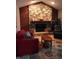 Comfortable living room features a stone fireplace, cozy seating, and inviting atmosphere at 12681 E 79Th St, Indianapolis, IN 46236