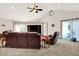 Bright living room with vaulted ceiling, fan, and comfortable seating arrangement at 12681 E 79Th St, Indianapolis, IN 46236