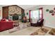 Comfortable living room with stone fireplace, large window, and plush seating at 12681 E 79Th St, Indianapolis, IN 46236