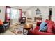 Bright living room with vaulted ceilings, large windows, and stylish furnishings at 12681 E 79Th St, Indianapolis, IN 46236
