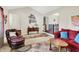 Inviting living room with hardwood floors, ample seating, and a decorative cabinet at 12681 E 79Th St, Indianapolis, IN 46236