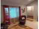 Bright living room featuring natural light, comfortable seating, and a warm, inviting ambiance at 12681 E 79Th St, Indianapolis, IN 46236