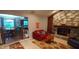 Inviting living room with stone fireplace and open layout to the kitchen and dining area at 12681 E 79Th St, Indianapolis, IN 46236