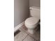 Close-up of a toilet in a bathroom with tile flooring at 12681 E 79Th St, Indianapolis, IN 46236