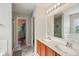 Bathroom boasts double sink vanity, large mirror and marble tile floors at 13063 E 131St St, Fishers, IN 46037