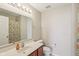 Bright bathroom features vanity with mirror, shower, and toilet at 13063 E 131St St, Fishers, IN 46037