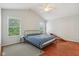 Bright bedroom with vaulted ceiling, ceiling fan, hardwood floors, and large windows at 13063 E 131St St, Fishers, IN 46037