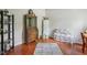 Bedroom featuring hardwood floors, bureau, and stylish accent chair at 13063 E 131St St, Fishers, IN 46037