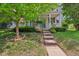 Charming home featuring a welcoming front porch, landscaped yard, and beautiful curb appeal at 13063 E 131St St, Fishers, IN 46037