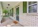The front porch features a brick facade, green shutters, and a welcoming entrance mat at 13063 E 131St St, Fishers, IN 46037