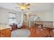 Upstairs loft featuring hardwood floors, seating, and plenty of light at 13063 E 131St St, Fishers, IN 46037