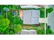 Aerial view of a well-maintained property featuring a fenced backyard, deck, and mature trees at 13295 Patriotic Way, Fishers, IN 46037