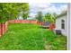 Spacious backyard with lush green grass and a privacy fence, ideal for outdoor activities at 13295 Patriotic Way, Fishers, IN 46037