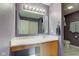 Charming bathroom featuring a large mirror with vanity lighting and modern fixtures at 13295 Patriotic Way, Fishers, IN 46037