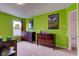 Bedroom featuring green walls, carpet flooring, and a window with natural light at 13295 Patriotic Way, Fishers, IN 46037