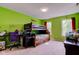 Bedroom with bright green walls, a wooden bunk bed, and a desk with a purple chair at 13295 Patriotic Way, Fishers, IN 46037