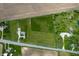 An aerial photograph displays the property, showcasing the home, fields and surrounding greenery at 133 W Us Highway 52, Fountaintown, IN 46130