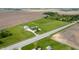 Overhead view of property with home, large outbuilding, vast fields, and mature trees at 133 W Us Highway 52, Fountaintown, IN 46130