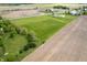 A captivating aerial view reveals an expansive property with a combination of fields, trees, and a meandering creek at 133 W Us Highway 52, Fountaintown, IN 46130