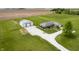 Aerial shot of property featuring a residence, outbuilding, and generous lawn space at 133 W Us Highway 52, Fountaintown, IN 46130