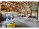 Expansive barn interior with exposed rafters, concrete floors, and versatile open space at 133 W Us Highway 52, Fountaintown, IN 46130