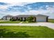 Ranch style home with brick facade, attached garage, large yard, and additional detached garage at 133 W Us Highway 52, Fountaintown, IN 46130