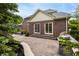 An outdoor patio with brick home exterior, grill, and landscape at 13309 Carmichael Ln, Carmel, IN 46074