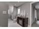 Neutral bath features white hexagon tile flooring, a wood cabinet, and gray paint at 13309 Carmichael Ln, Carmel, IN 46074