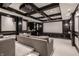Basement home theater with comfortable seating and a large projector screen at 13309 Carmichael Ln, Carmel, IN 46074