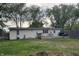 Backyard view with a patio, lawn, and wooden fence offering a private outdoor space for relaxation at 1505 Apple St, Greenfield, IN 46140