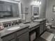 A bathroom features a double-sink vanity with granite countertops and neutral paint at 1515 Renee Dr, Plainfield, IN 46168