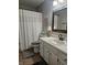 The bathroom has a single sink vanity with gray accents and a framed mirror at 1515 Renee Dr, Plainfield, IN 46168