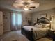 Cozy main bedroom with decorative accents, ceiling fan, and comfortable queen bed at 1515 Renee Dr, Plainfield, IN 46168
