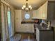 Well-lit kitchen with ample cabinet space, granite countertops and view to backyard at 1515 Renee Dr, Plainfield, IN 46168