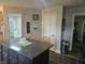 Kitchen island with granite countertop and room for seating, adjacent to breakfast nook at 1515 Renee Dr, Plainfield, IN 46168